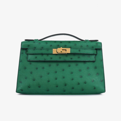 Vivid Emerald Green Speckled Slim Rectangular Mini Hand Pouch With Radiant Warm Golden Twist Lock Hardware And Sleek Curved Top Carry Handle