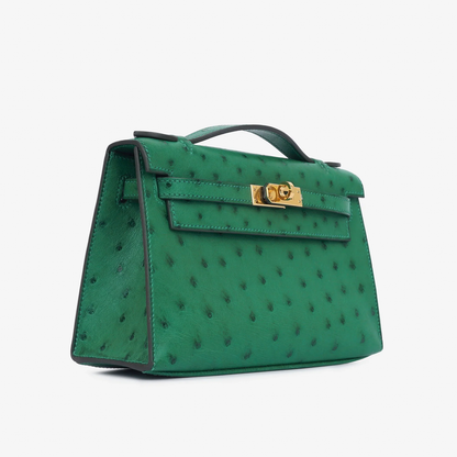 Vivid Emerald Green Speckled Slim Rectangular Mini Hand Pouch With Radiant Warm Golden Twist Lock Hardware And Sleek Curved Top Carry Handle