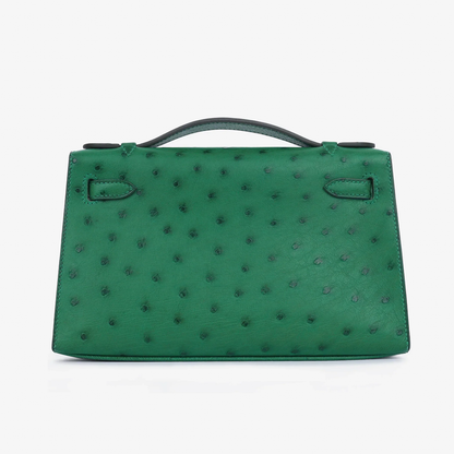 Vivid Emerald Green Speckled Slim Rectangular Mini Hand Pouch With Radiant Warm Golden Twist Lock Hardware And Sleek Curved Top Carry Handle